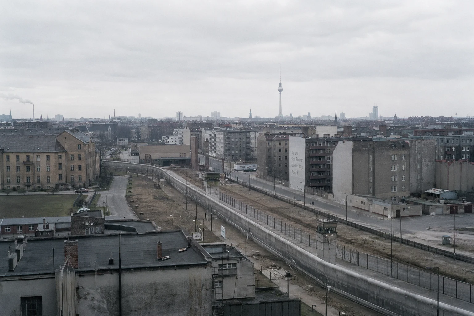 A town skyline under a cloudy sky.